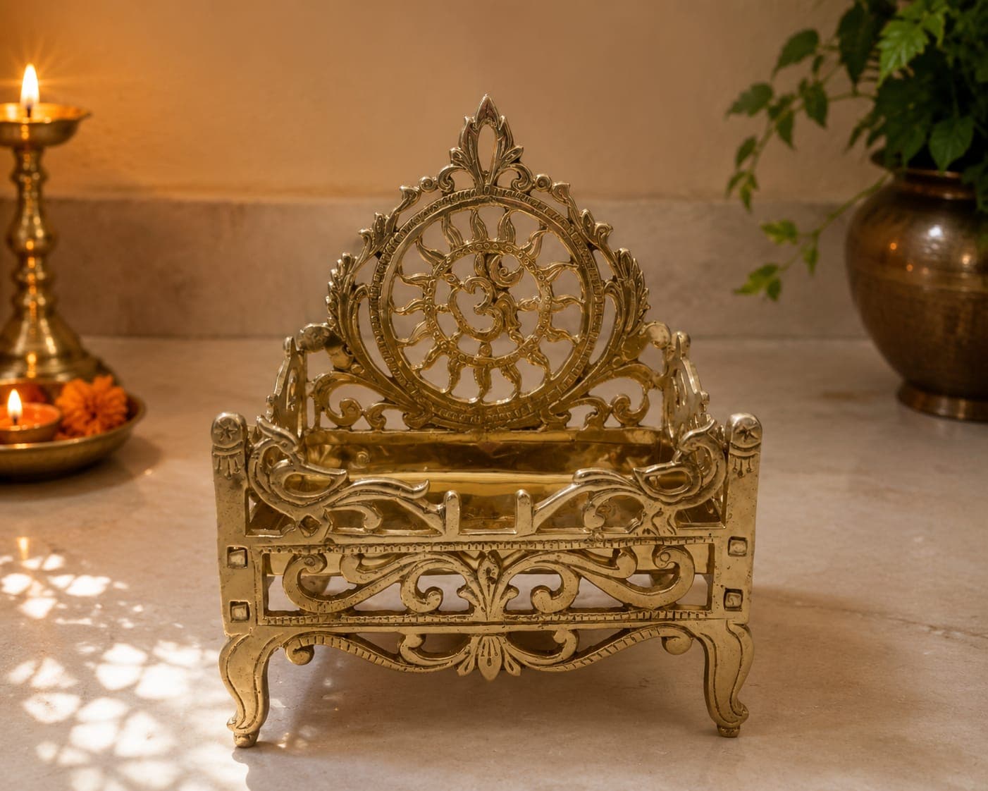 Peacock Golden Singhasan lit with a diya